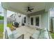 Covered patio with ceiling fan and seating area, perfect for outdoor entertaining at 3205 Berry Creek Rd, Charlotte, NC 28214