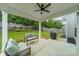 Spacious, covered patio with lounge seating and a view of the expansive backyard at 3205 Berry Creek Rd, Charlotte, NC 28214