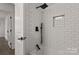 Bathroom offers a shower over tub with white subway tile surround, black hardware, and niche for toiletries at 3538 Denson Pl, Charlotte, NC 28215