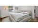 This bedroom is painted white and has neutral colors and textures that create a clean and relaxing space at 3538 Denson Pl, Charlotte, NC 28215