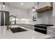 Gourmet kitchen with stainless steel appliances and white subway tile backsplash at 3538 Denson Pl, Charlotte, NC 28215