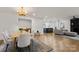 Open concept with new hardwood floors, a dining room and fireplace at 3538 Denson Pl, Charlotte, NC 28215