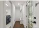 Mudroom with washer and dryer, bench, and exterior door for convenience at 3538 Denson Pl, Charlotte, NC 28215