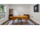 Cozy home office with hardwood floors, a wooden desk, and ample natural light from a large window at 3538 Denson Pl, Charlotte, NC 28215