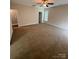 Large bedroom with plush carpeting, neutral paint, and natural lighting at 4048 Avis Way, Monroe, NC 28110
