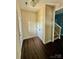 Inviting foyer with hardwood floors, closet, and staircase leading to the upper level at 4048 Avis Way, Monroe, NC 28110