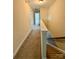 Carpeted hallway leading to the stairs and other rooms at 4048 Avis Way, Monroe, NC 28110