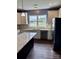Bright kitchen with stainless steel appliances, white cabinetry, and granite countertops at 4048 Avis Way, Monroe, NC 28110