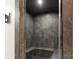 Contemporary steam shower featuring gray tiling, bench seating, and glass door at 4135 Mineral Ln, Lincolnton, NC 28092
