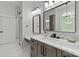 Bathroom featuring double vanity with white marble counter, wood cabinets and glass enclosed shower at 4135 Mineral Ln, Lincolnton, NC 28092