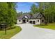 Stunning exterior of a modern two-story home with a long driveway and three-car garage at 4135 Mineral Ln, Lincolnton, NC 28092
