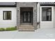 Stone clad entrance with modern double doors at 4135 Mineral Ln, Lincolnton, NC 28092