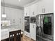 Modern kitchen featuring stainless steel appliances and white cabinets with black hardware at 4135 Mineral Ln, Lincolnton, NC 28092