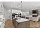Open-concept kitchen with a large island, seamlessly connecting to the dining and living areas at 4135 Mineral Ln, Lincolnton, NC 28092