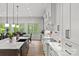 Open-concept kitchen with large windows, a center island, and modern finishes at 4135 Mineral Ln, Lincolnton, NC 28092