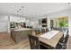 Modern kitchen flows into the dining area, featuring an island and access to an outdoor patio at 4135 Mineral Ln, Lincolnton, NC 28092