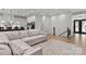 Spacious living room featuring a large sectional, fireplace, and open access to the kitchen at 4135 Mineral Ln, Lincolnton, NC 28092