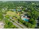 Aerial view of community amenities: pool, tennis courts, playground, and green space at 4201 Beauvista Dr, Charlotte, NC 28269