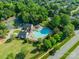 Aerial view of the community pool and amenities surrounded by lush greenery at 4201 Beauvista Dr, Charlotte, NC 28269