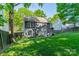 Large backyard with a well-manicured lawn and mature trees, perfect for outdoor activities at 4201 Beauvista Dr, Charlotte, NC 28269