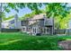 Spacious backyard with a well-kept lawn, patio area, and privacy fence, perfect for outdoor enjoyment at 4201 Beauvista Dr, Charlotte, NC 28269