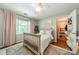 Inviting bedroom featuring a queen bed, closet, and hardwood flooring under a patterned rug at 4201 Beauvista Dr, Charlotte, NC 28269