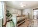 Cozy bedroom with natural light, wood furniture, and a neutral color scheme at 4201 Beauvista Dr, Charlotte, NC 28269