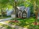 Beautiful two-story home with a well-maintained lawn and mature trees providing shade at 4201 Beauvista Dr, Charlotte, NC 28269
