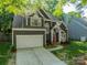 Charming two-story home with a well-maintained front yard, attached garage, and inviting front entrance at 4201 Beauvista Dr, Charlotte, NC 28269
