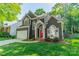 Charming home with a red front door, well-maintained lawn, and inviting curb appeal at 4201 Beauvista Dr, Charlotte, NC 28269