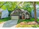 Charming two-story home features a well-maintained yard, two car garage, and a vibrant red door at 4201 Beauvista Dr, Charlotte, NC 28269