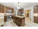 Spacious kitchen with a granite island, stainless steel appliances, and ample cabinetry at 4201 Beauvista Dr, Charlotte, NC 28269