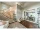 Inviting living room showcasing an open floor plan, a staircase, and views of the dining room at 4201 Beauvista Dr, Charlotte, NC 28269