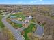 Community aerial view, highlighting parking, playground, tennis courts, pool, and clubhouse at 422 Deer Brush Ln, Waxhaw, NC 28173