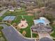 Beautiful aerial view of community amenities including a pool, playground, clubhouse, basketball and tennis courts at 422 Deer Brush Ln, Waxhaw, NC 28173