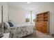 The bedroom features neutral carpet, natural light, and has a four poster bed at 422 Deer Brush Ln, Waxhaw, NC 28173