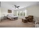 Bright bedroom with large windows and a ceiling fan at 422 Deer Brush Ln, Waxhaw, NC 28173