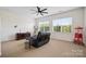 Bonus room features large windows, theater seating, and neutral carpet at 422 Deer Brush Ln, Waxhaw, NC 28173