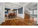 Elegant dining room with hardwood floors, stylish furnishings, and wainscoting at 422 Deer Brush Ln, Waxhaw, NC 28173