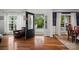 Welcoming foyer with hardwood floors, decorative glass door, and natural light at 422 Deer Brush Ln, Waxhaw, NC 28173
