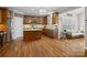 Spacious kitchen with hardwood floors, central island, and stainless steel appliances at 422 Deer Brush Ln, Waxhaw, NC 28173