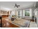 Relaxing living area with hardwood floors, large windows and an open view to the kitchen at 422 Deer Brush Ln, Waxhaw, NC 28173
