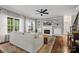 Comfortable living room featuring a fireplace, built-in shelving, and large windows at 422 Deer Brush Ln, Waxhaw, NC 28173