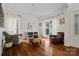 Bright living room with hardwood floors, natural light, and comfortable seating at 422 Deer Brush Ln, Waxhaw, NC 28173