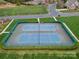 Aerial shot of the community tennis courts, surrounded by manicured landscaping and green space at 422 Deer Brush Ln, Waxhaw, NC 28173