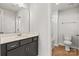 Bathroom featuring a single vanity with a mirror, tiled floors, and a toilet at 423 Shallowford Dr, Rock Hill, SC 29732
