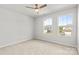 Bedroom with neutral carpet, fresh paint, ceiling fan, and view of neighborhood at 423 Shallowford Dr, Rock Hill, SC 29732