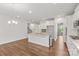 Bright kitchen featuring a center island with seating, stainless steel appliances, and tile backsplash at 423 Shallowford Dr, Rock Hill, SC 29732