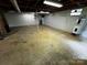 Spacious unfinished basement area for storage or workshop space at 5068 King Wilkinson Rd, Denver, NC 28037