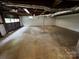 Unfinished basement with concrete floor and exposed ductwork at 5068 King Wilkinson Rd, Denver, NC 28037